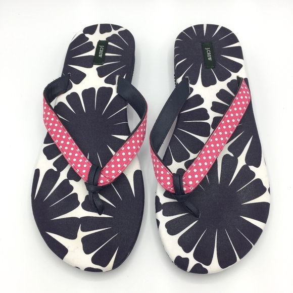 white fabric flip flops